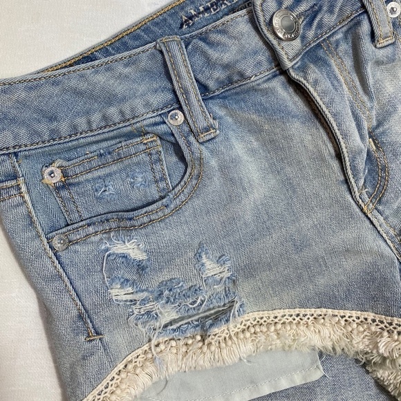 AE 4 shortie pom pom fringe distressed jean shorts - Picture 2 of 8